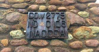 Commemorative plaque mounted in the CCC Camp V2775 chimney