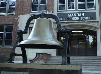 Central School's bronze bell on its outdoor plinth in 2015