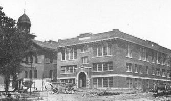 The 1911 Mandan High School addition with Central School at left