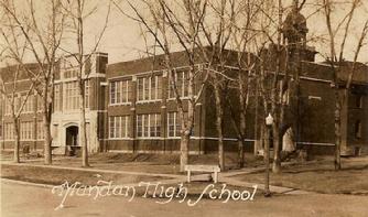 The new Mandan High School in 1934 with Central School behind it