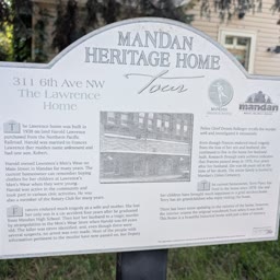 A Heritage Home sign for the Lawrence Home